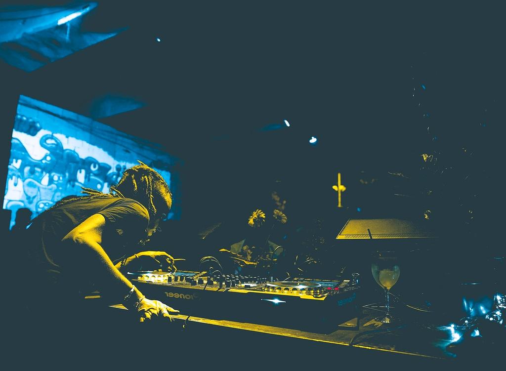 Vibrant multi-room nightclub with colorful neon lighting and modern design